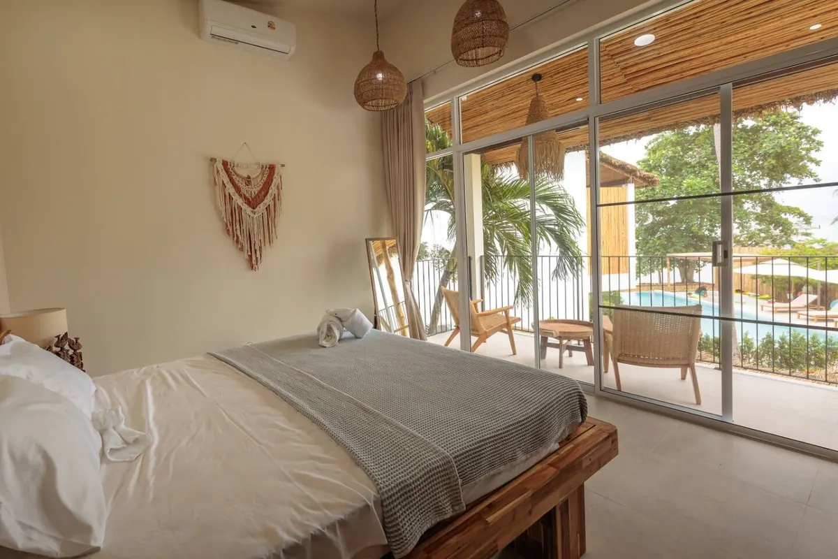 Baan Tai Cozy Beachfront House, Baan Tai — bedroom with pool-facing glass doors — Crazy GAKKO Stay