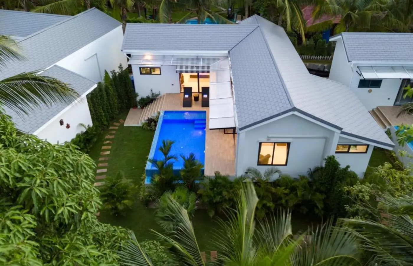 White garden villa and pool at Bougain Villas — Crazy GAKKO Stay
