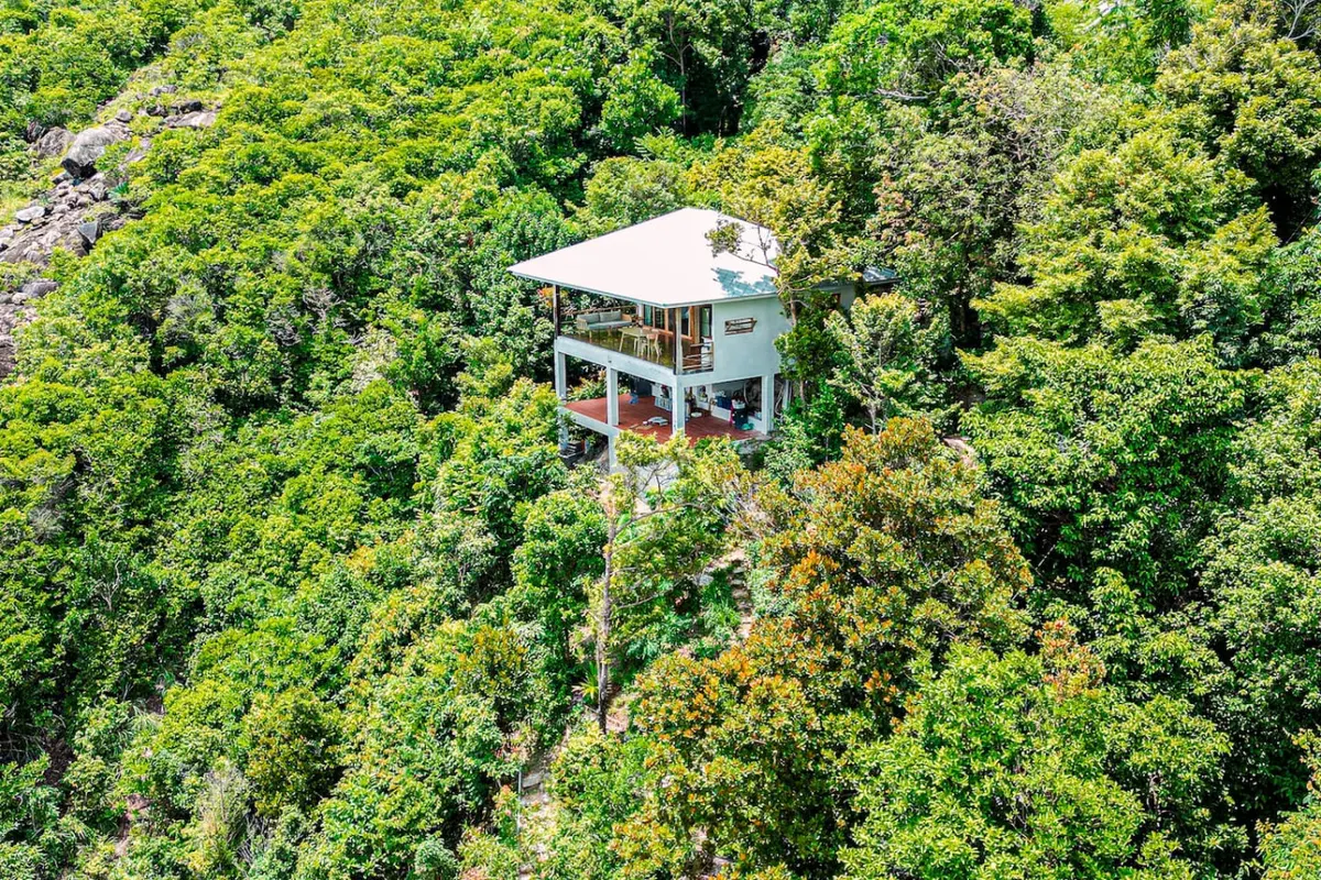 Samathí Oceanfront Retreat, Northern Koh Phangan — small house set into the green hillside — Crazy GAKKO Stay