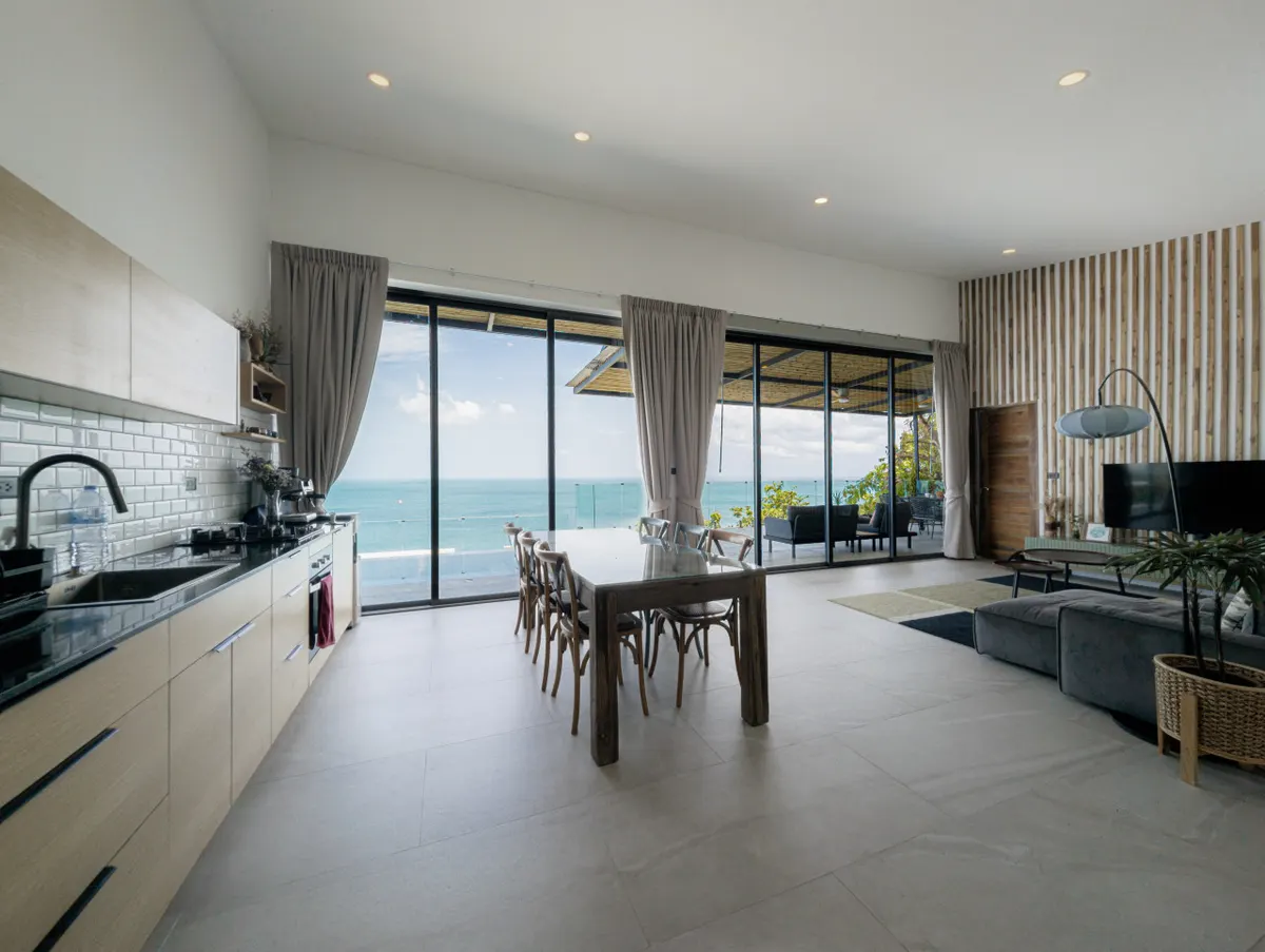 The Serenity Villa, Haad Yao — living and dining area overlooking the water — Crazy GAKKO Stay