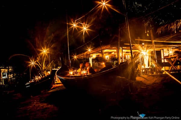 Fishing-boat seating and beach lights at Fisherman’s Restaurant in Baan Tai